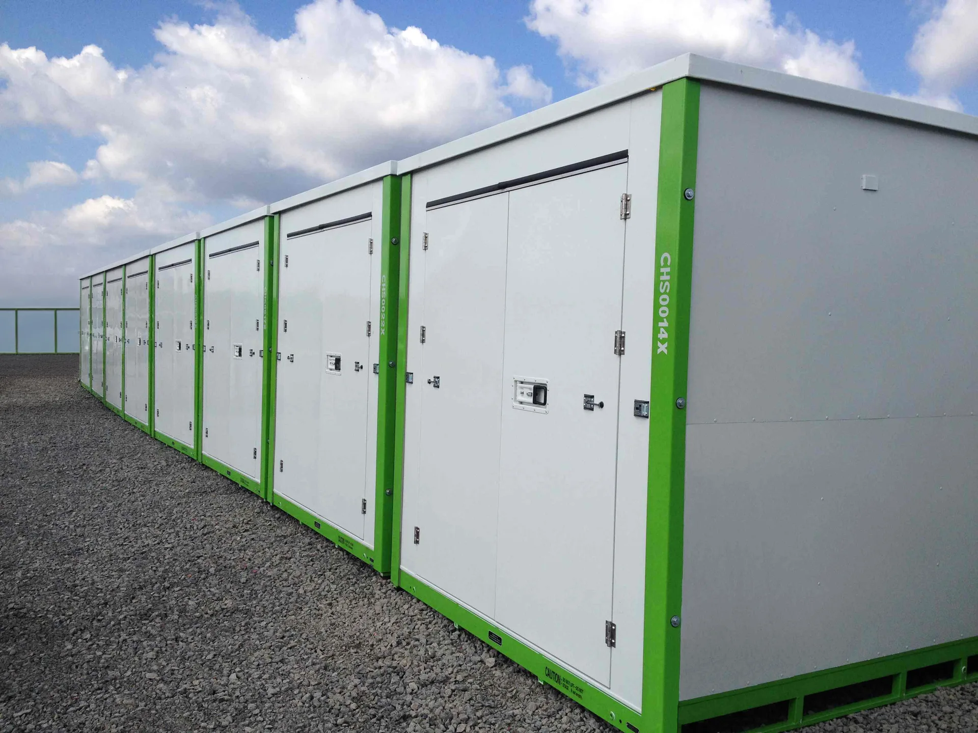 White storage containers with green trim