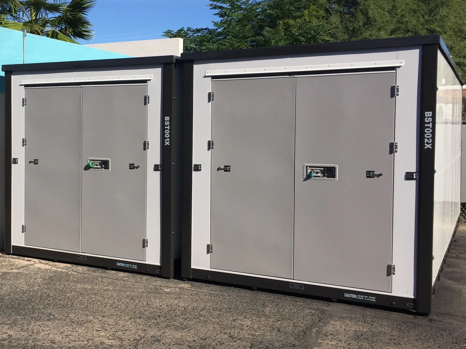 Two grey storage containers with white trim
