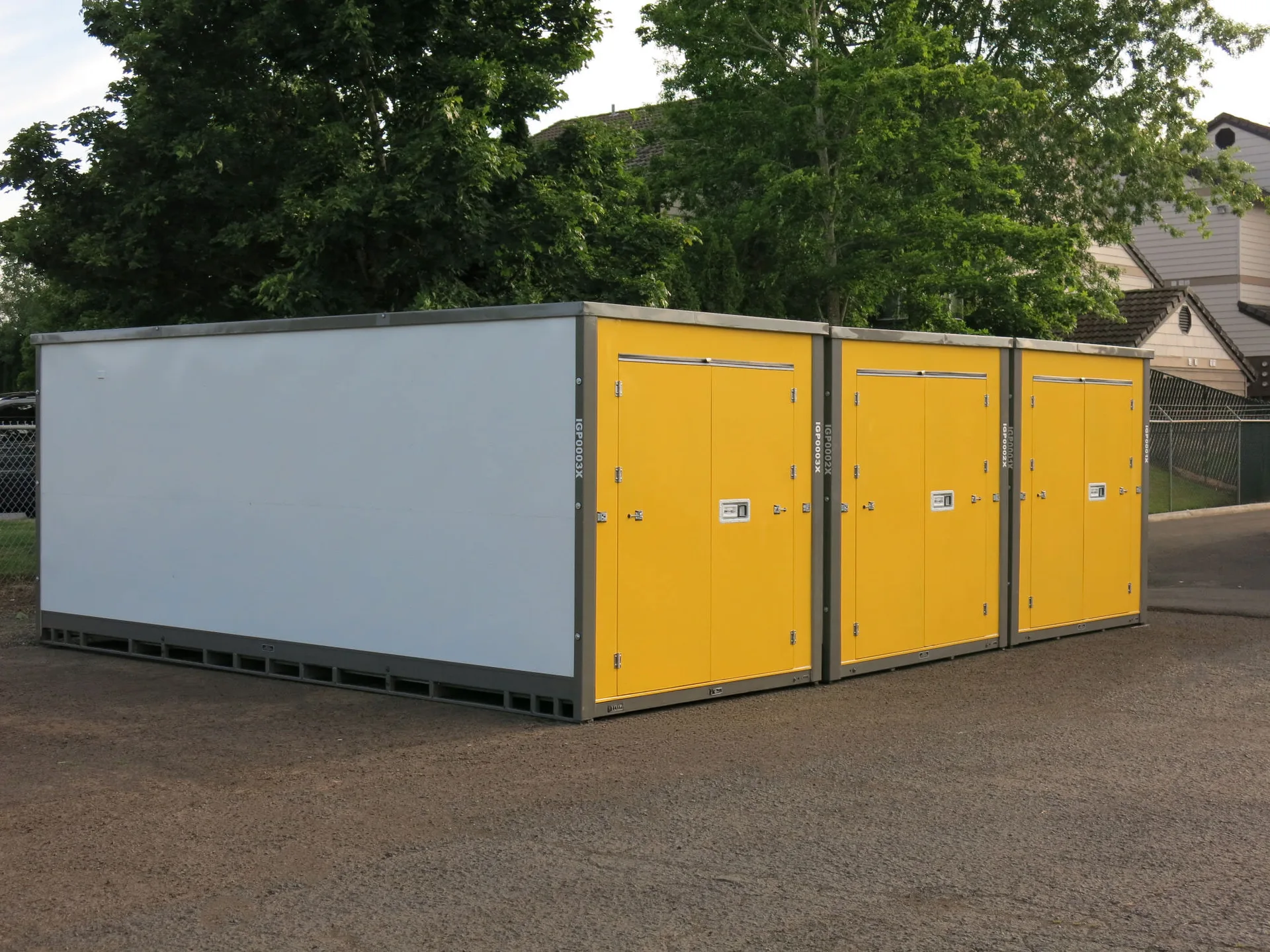 White storage containers with yellow doors